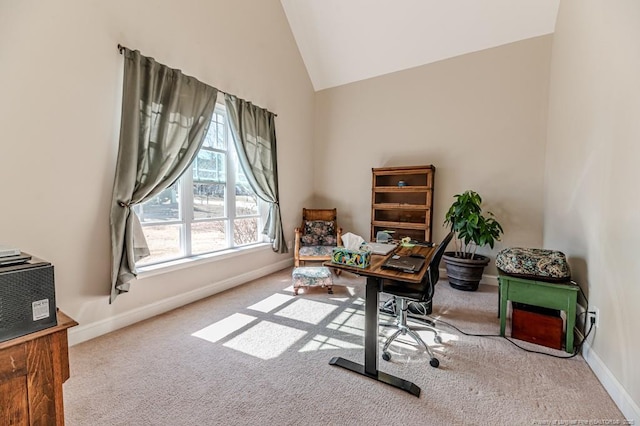 office area with high vaulted ceiling and carpet flooring