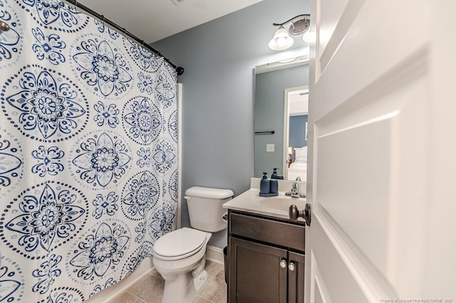 bathroom featuring vanity, tile patterned flooring, a shower with curtain, and toilet