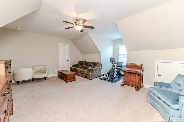 living area featuring lofted ceiling, light carpet, and ceiling fan