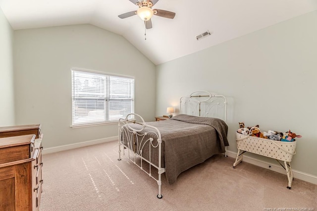 carpeted bedroom featuring ceiling fan and vaulted ceiling