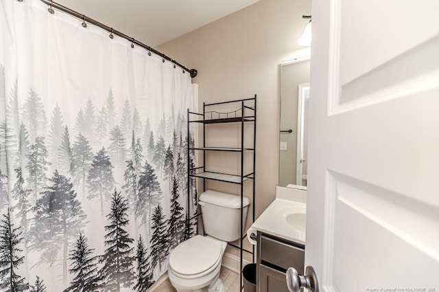 bathroom featuring vanity and toilet