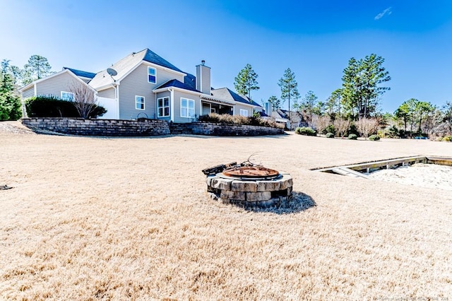 exterior space with a fire pit