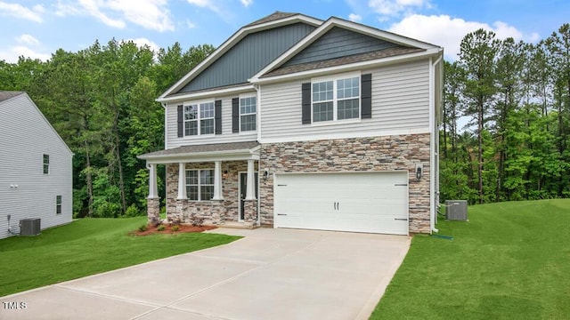 1009 Ocean Ct, Carthage, NC 28327 - craftsman inspired home featuring stone siding, an attached garage, concrete driveway, and a front yard