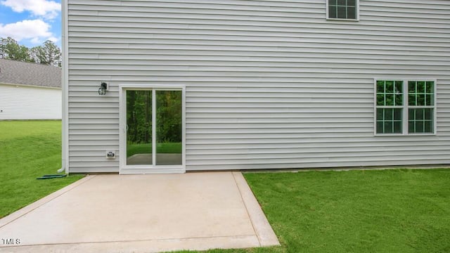 1009 Ocean Ct, Carthage, NC 28327 - doorway to property featuring a patio and a yard