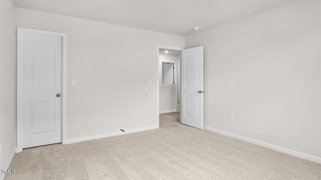 1009 Ocean Ct, Carthage, NC 28327 - unfurnished bedroom with light colored carpet and baseboards
