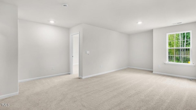 1009 Ocean Ct, Carthage, NC 28327 - empty room featuring light colored carpet, recessed lighting, and a smoke detector