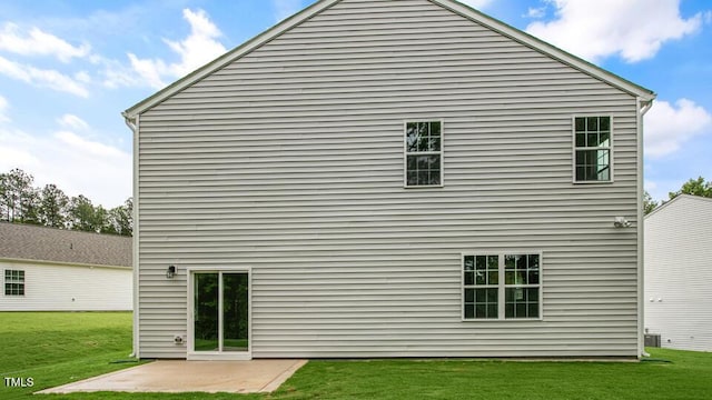 1009 Ocean Ct, Carthage, NC 28327 - back of property featuring a patio area and a lawn