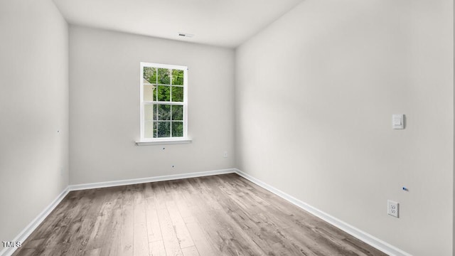 1009 Ocean Ct, Carthage, NC 28327 - spare room featuring wood finished floors and baseboards