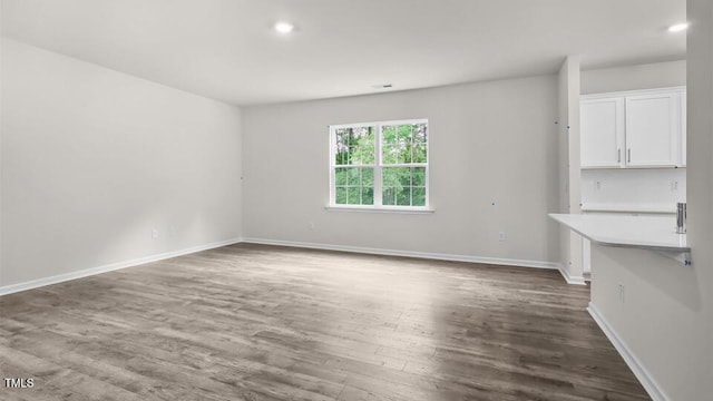 1009 Ocean Ct, Carthage, NC 28327 - unfurnished dining area featuring dark wood-style flooring and recessed lighting