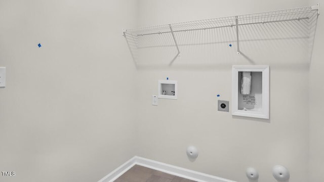 1009 Ocean Ct, Carthage, NC 28327 - laundry area featuring gas dryer hookup, hookup for an electric dryer, hookup for a washing machine, and dark wood-style flooring