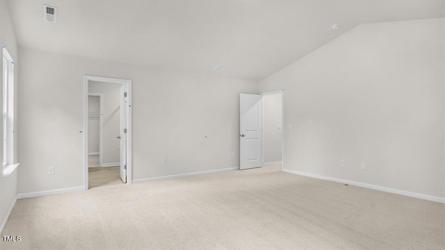 1009 Ocean Ct, Carthage, NC 28327 - unfurnished bedroom with lofted ceiling, light carpet, a walk in closet, and a closet