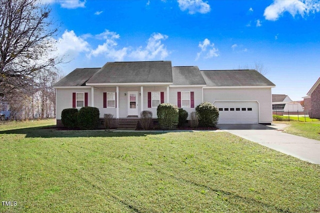 view of front of house featuring a front lawn and a garage