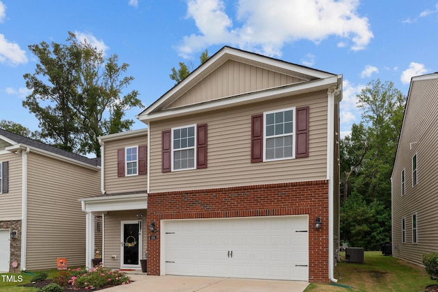 view of front of house with a garage and central AC