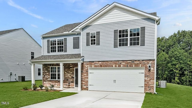 989 Ocean Ct, Carthage, NC 28327 - view of front of home with a front lawn, driveway, a garage, roof with shingles, and brick siding