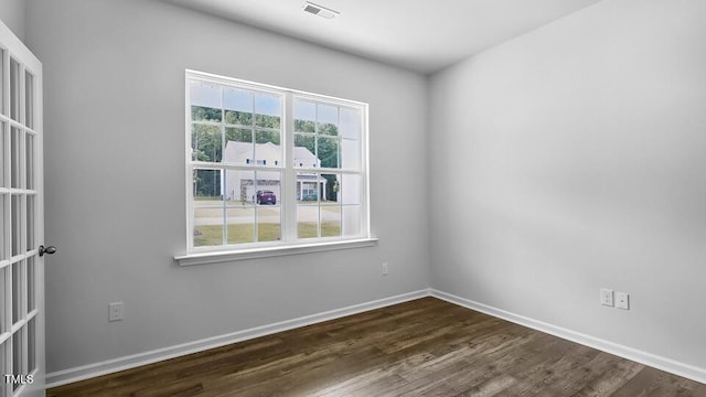 989 Ocean Ct, Carthage, NC 28327 - spare room with healthy amount of natural light and dark wood-type flooring