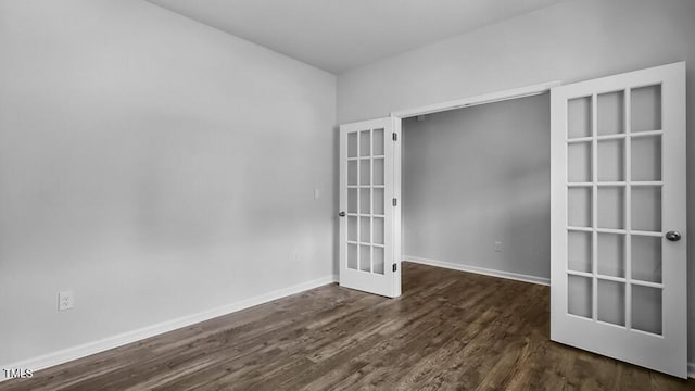 989 Ocean Ct, Carthage, NC 28327 - spare room with french doors and dark wood finished floors