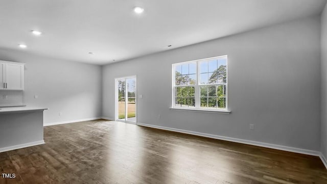 989 Ocean Ct, Carthage, NC 28327 - unfurnished living room featuring recessed lighting and dark wood-type flooring