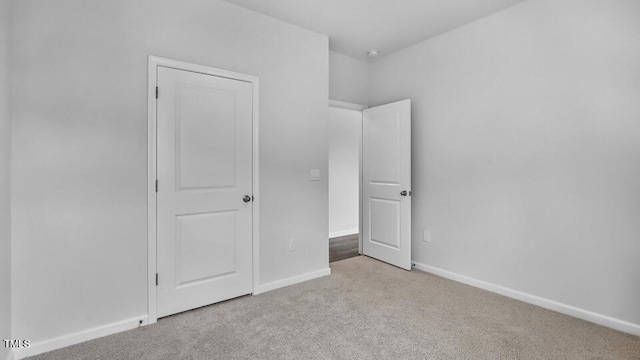 989 Ocean Ct, Carthage, NC 28327 - unfurnished bedroom featuring carpet floors and baseboards