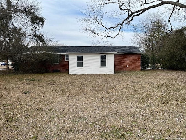 view of outbuilding featuring a lawn