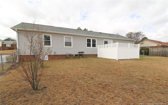 back of house with a yard