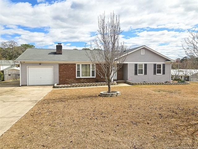 ranch-style house featuring driveway, an attached garage, a chimney, and brick siding