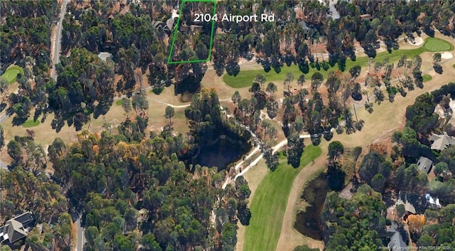 birds eye view of property with golf course view