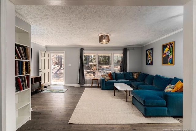 living area with baseboards, ornamental molding, dark wood-style flooring, and a textured ceiling