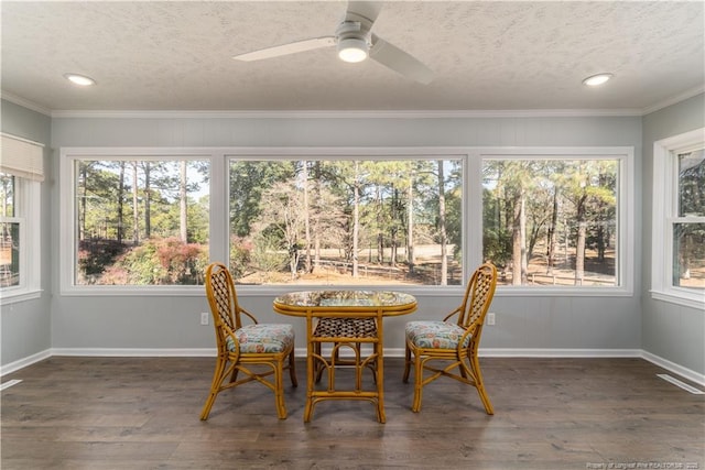sunroom / solarium featuring recessed lighting, visible vents, a healthy amount of sunlight, and wood finished floors