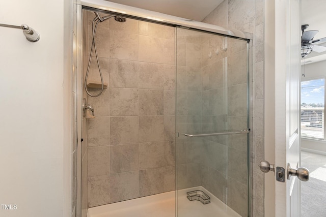 full bathroom featuring tiled shower