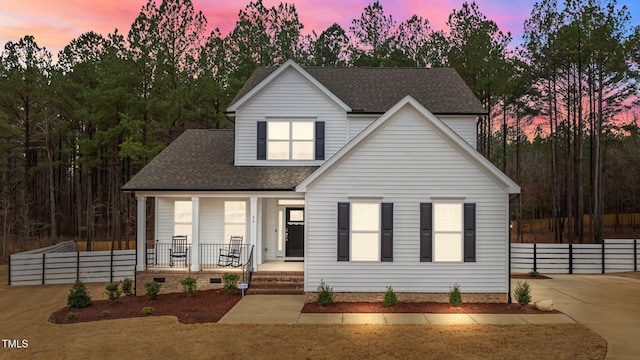 view of front of house featuring crawl space, roof with shingles, covered porch, and fence