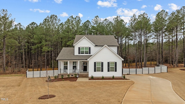 40 Long Needle Ct, Youngsville, NC 27596 - view of front of home featuring fence, a porch, driveway, and roof with shingles
