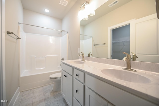 full bathroom featuring tile patterned flooring, vanity, toilet, and  shower combination