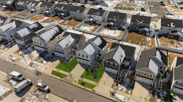 birds eye view of property with a residential view