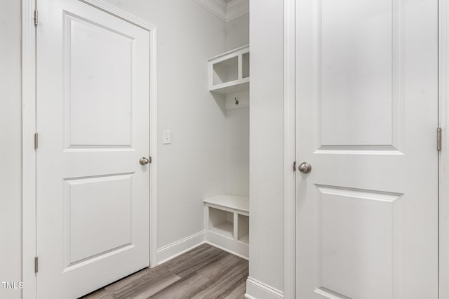 mudroom featuring baseboards and wood finished floors