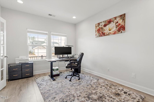 office area with recessed lighting, light wood-type flooring, visible vents, and baseboards