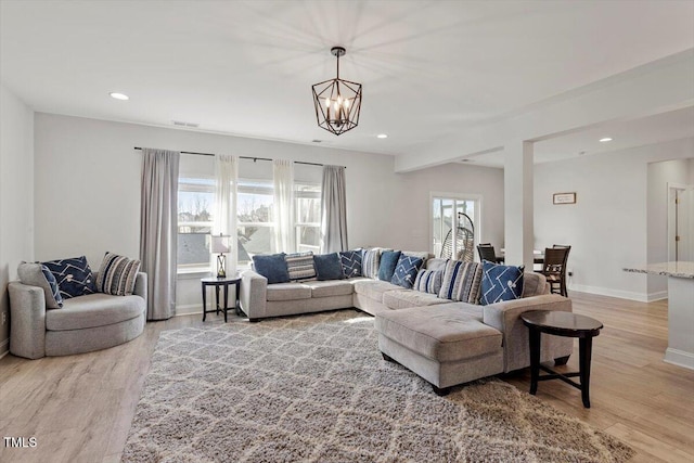 living room with a chandelier, recessed lighting, visible vents, baseboards, and light wood-style floors