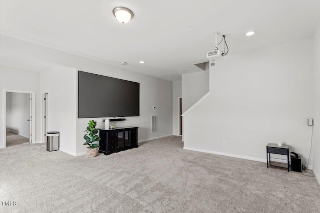 unfurnished living room featuring carpet floors, recessed lighting, visible vents, and baseboards