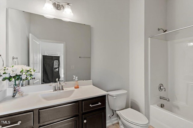 bathroom featuring vanity, toilet, and shower / bathtub combination