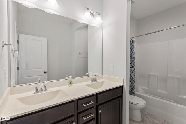 full bathroom featuring toilet, a sink, tile patterned floors, double vanity, and shower / bath combination with curtain