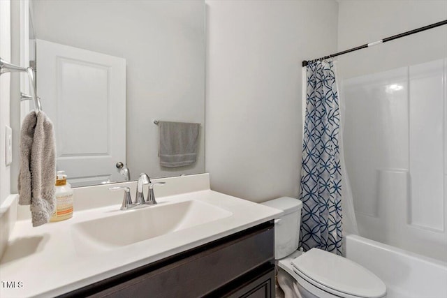 full bath featuring shower / bathtub combination with curtain, vanity, and toilet