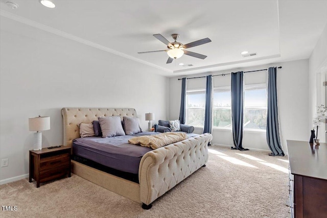 bedroom featuring a tray ceiling, recessed lighting, light colored carpet, ceiling fan, and baseboards