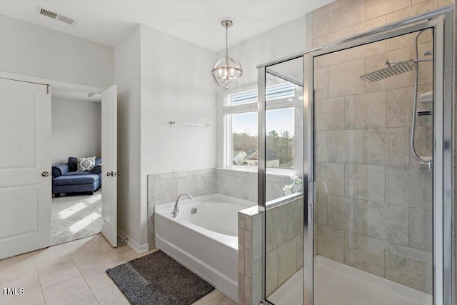 full bath featuring a stall shower, a garden tub, visible vents, and tile patterned floors