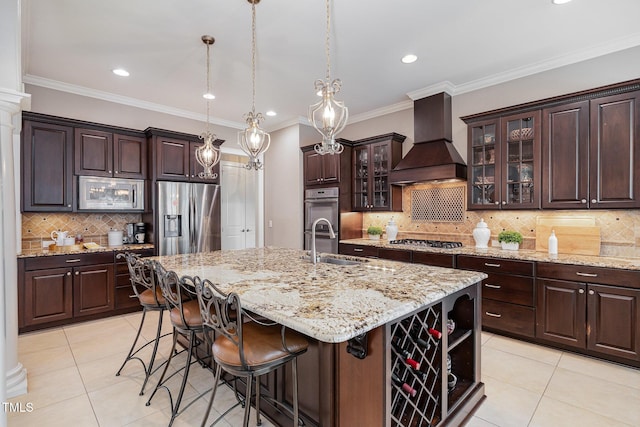 kitchen featuring light tile patterned floors, dark brown cabinets, stainless steel appliances, and premium range hood