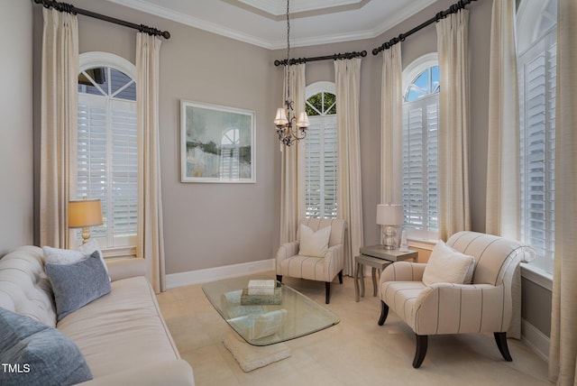 living area with a wealth of natural light, baseboards, an inviting chandelier, and crown molding