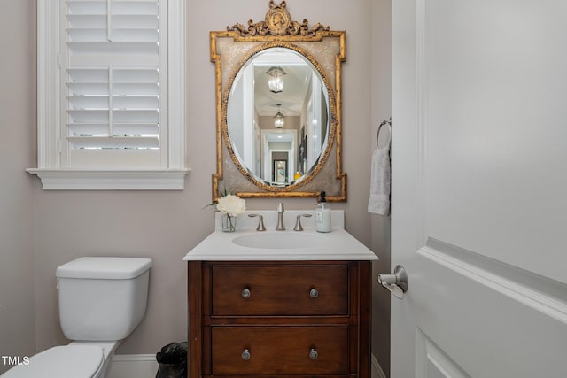 bathroom featuring vanity and toilet