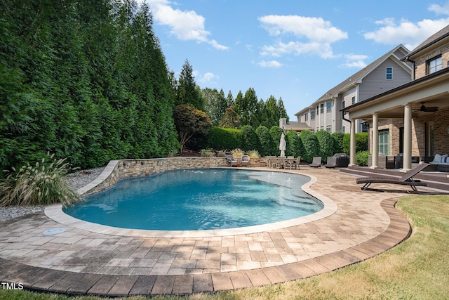 pool featuring a ceiling fan and a patio