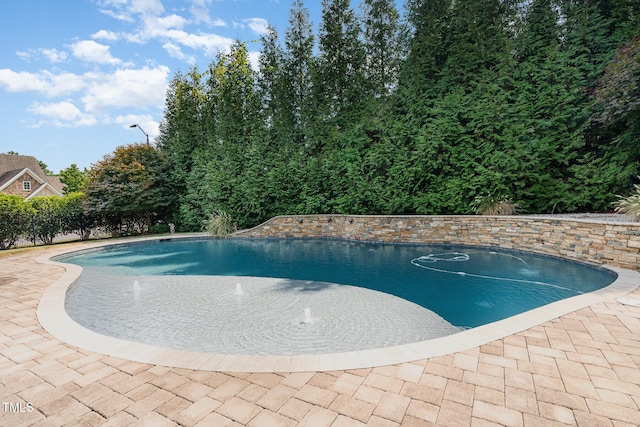 outdoor pool with a patio