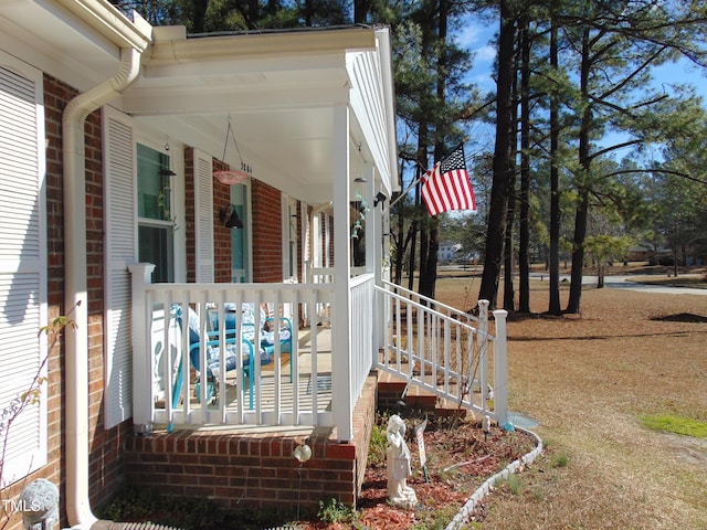 view of property exterior featuring a porch