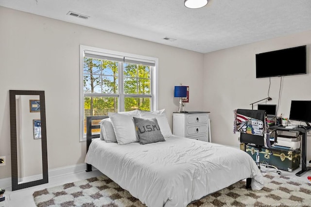 bedroom featuring a textured ceiling