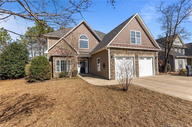 craftsman-style home with a garage and a front lawn